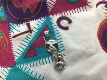 Wolf pendant with turquoise