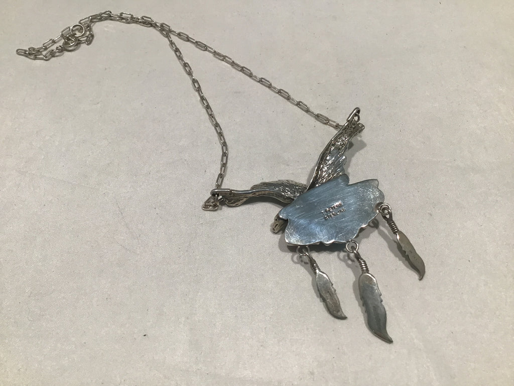 Back of turquoise and coral eagle necklace
