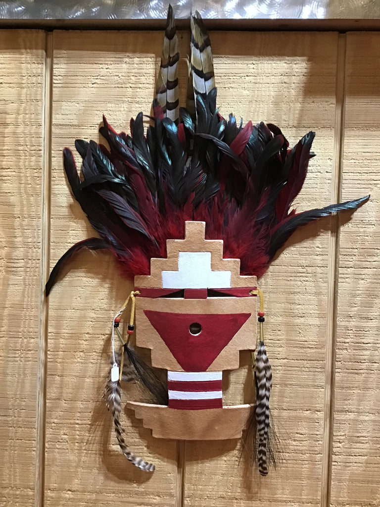 painted mask with feathers